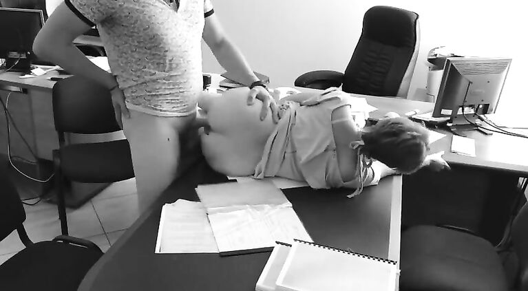 The boss fucks his tiny secretary on the office table and films it on hidden camera