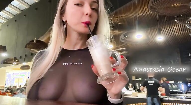 Public - Sexy blonde flashes her big natural tits in a crowded cafe.