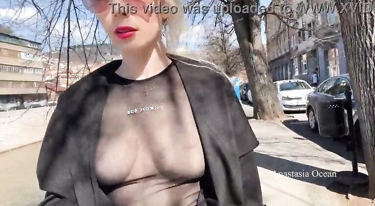 Public city walk in see-through top. Flashing tits to for passer-by to see.